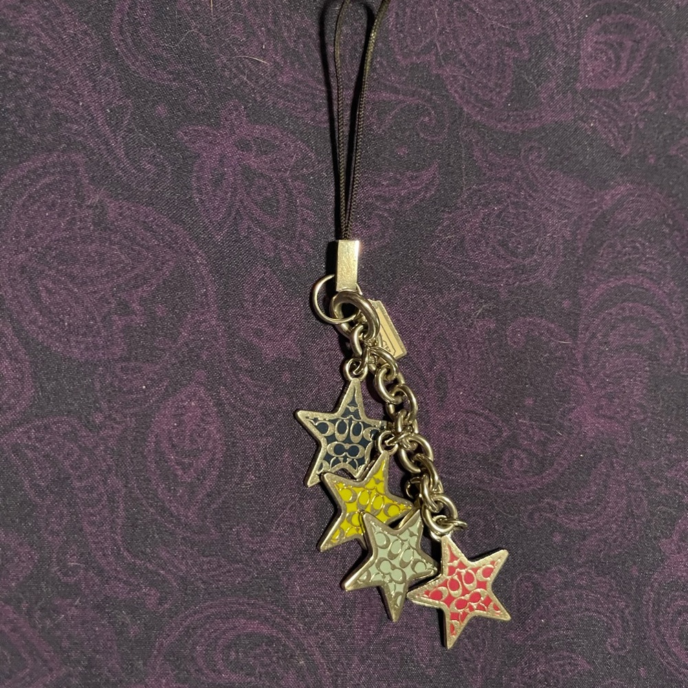 Coach charm. Multicolored stars with coach logo. Very cute.
